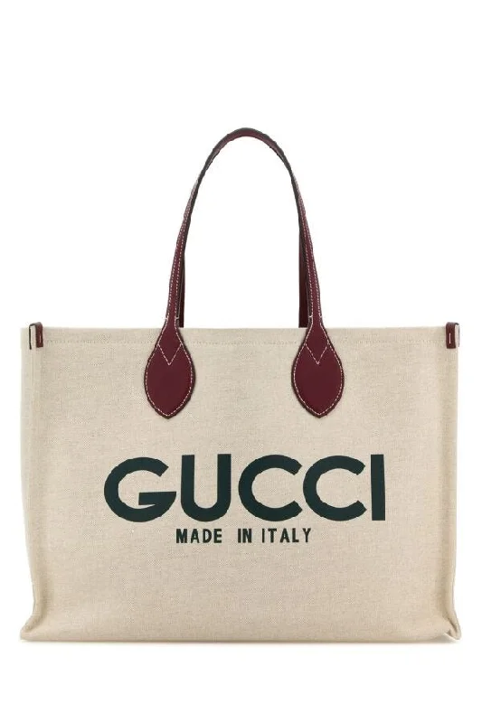 Gucci Marmont bags for women with a contrast - colored interiorGucci Women Sand Canvas Shopping Bag