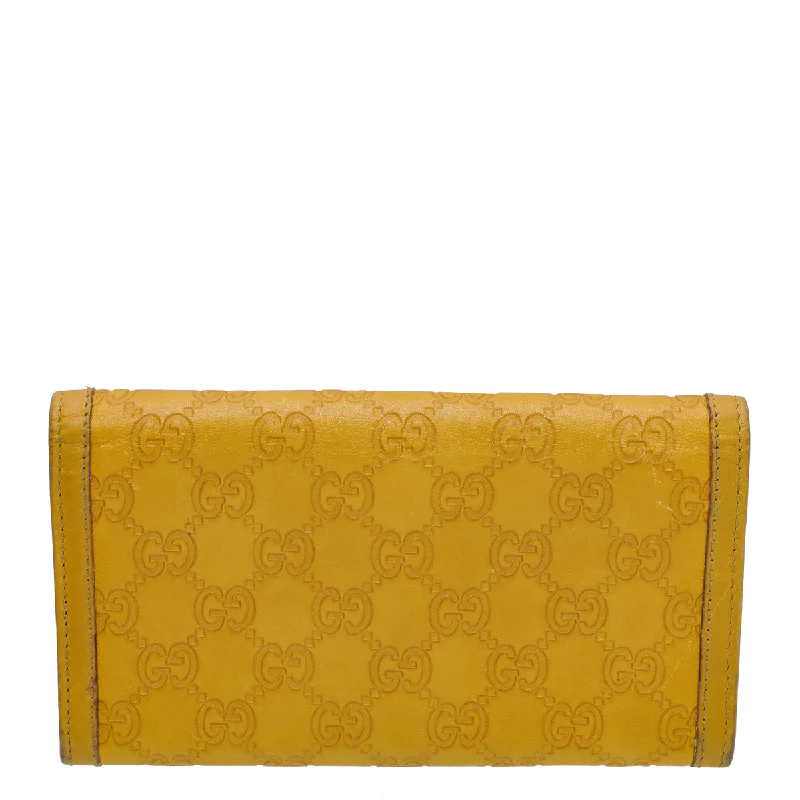 Gucci tote bags for women with a printed Gucci logoGucci Yellow Guccissima Sukey Continental Wallet