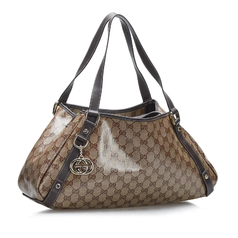 Women Gucci bags with a snap - button closure and a decorative charmGucci GG Crystal Pelham Tote (SHG-37775)