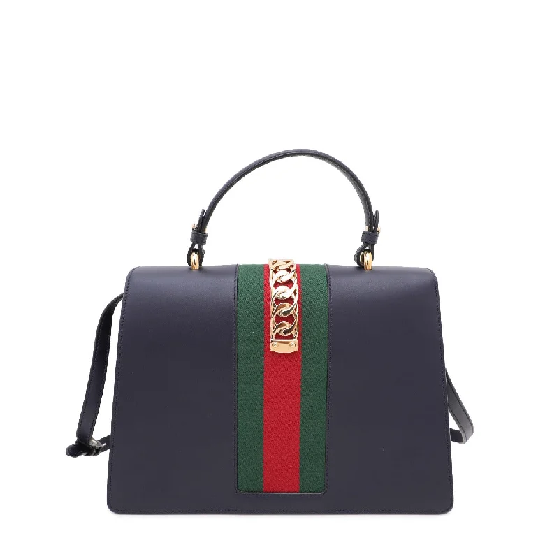 Ladies Gucci shoulder bags with a tassel decorationGucci Navy Blue Sylvie Medium Bag