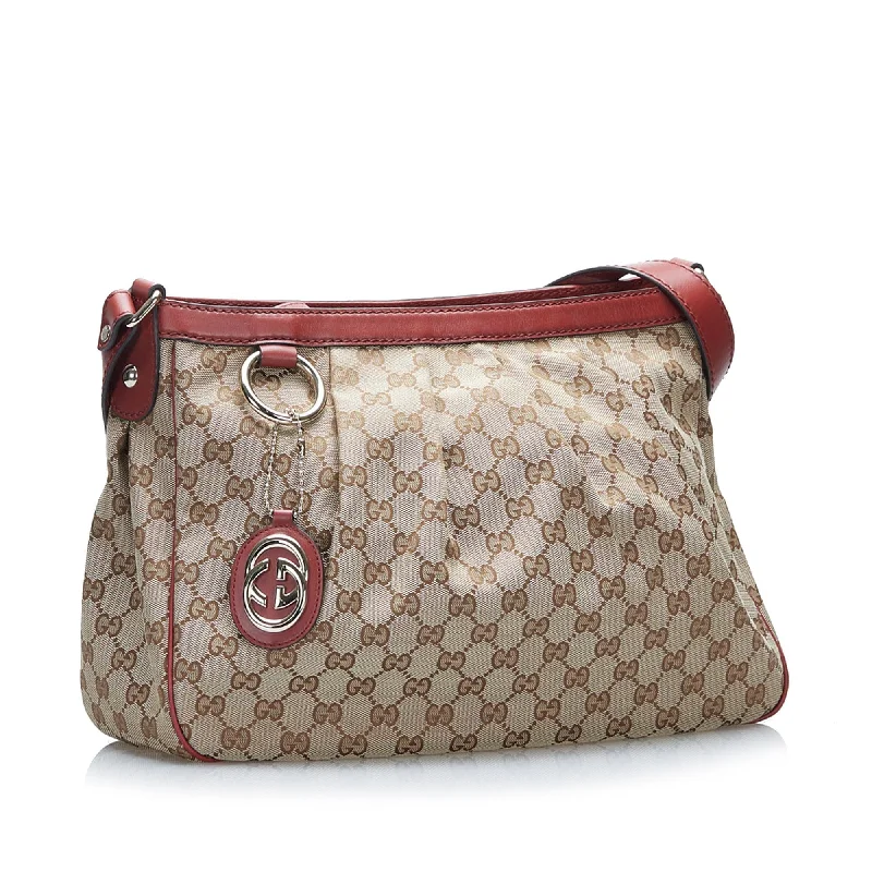 Women Gucci bags with a snap - button closure and a decorative charmGucci GG Canvas Sukey Crossbody (SHG-37499)